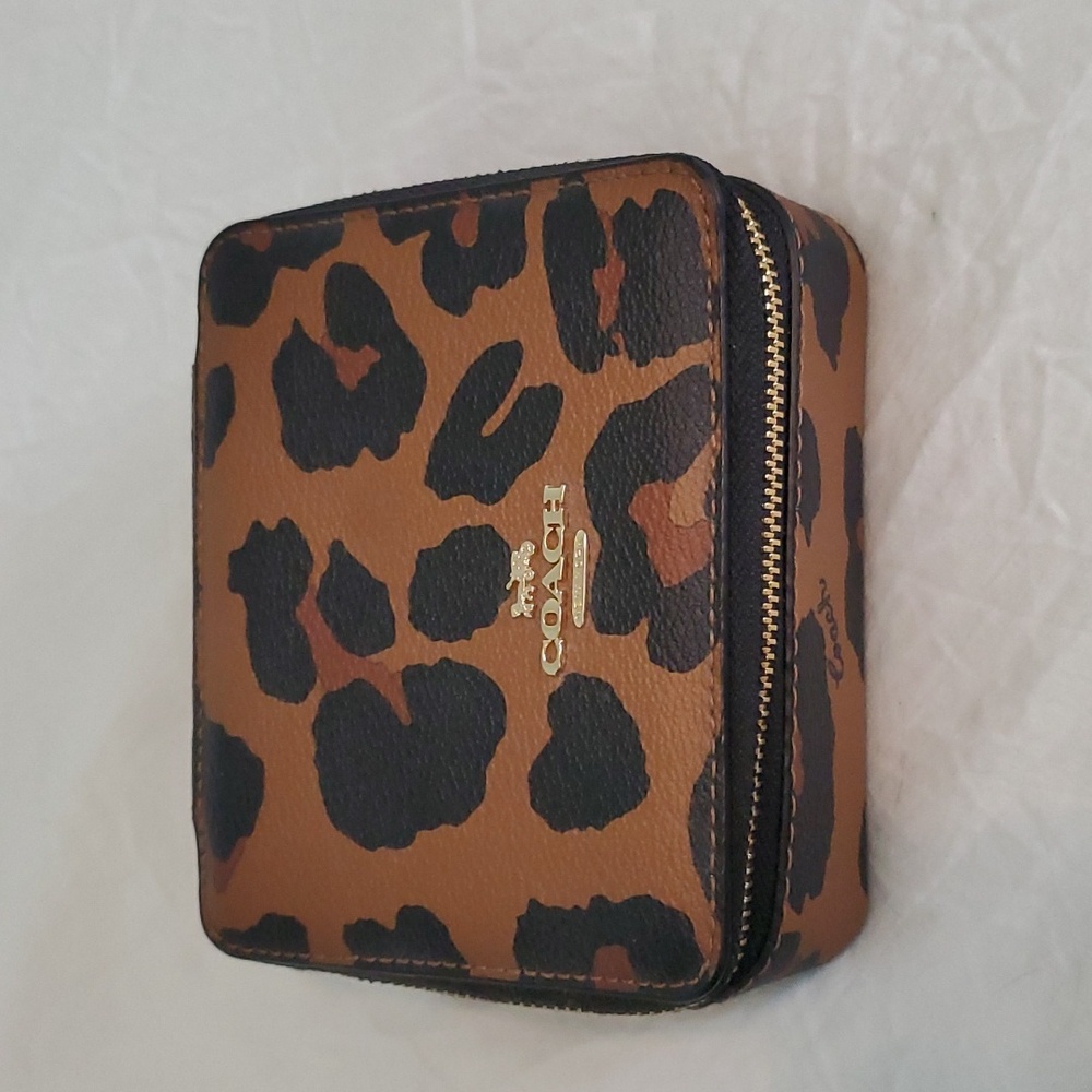 Brand new Coach travel jewelry case.
